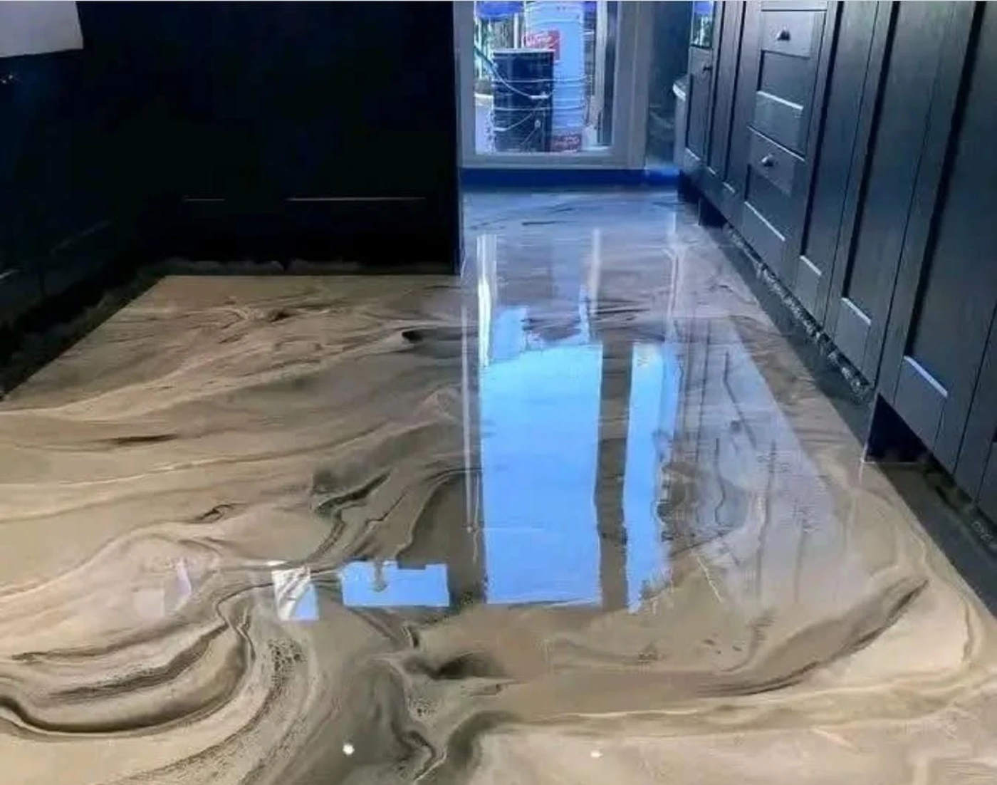 Wide crop of smoky metallic epoxy flooring