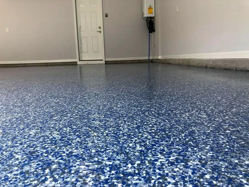 Close view of a blue and white flake garage floor