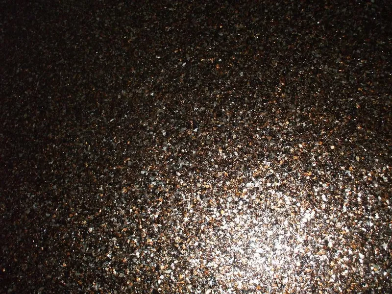 Dark flake garage floor with a glossy topcoat
