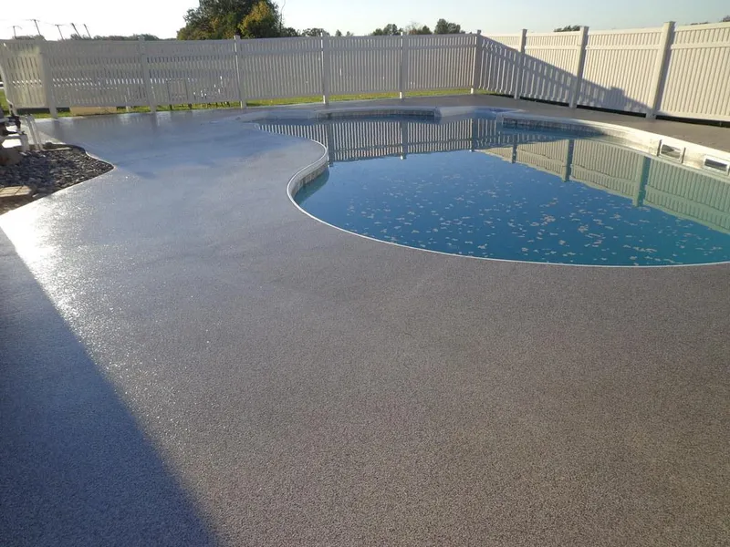 Gray flake coating on a curved pool deck