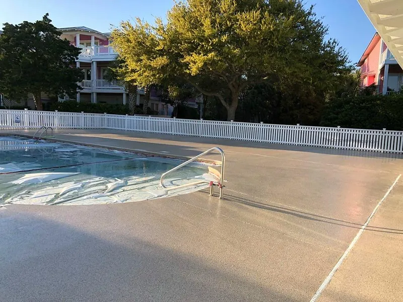 Tan coated pool deck at sunset
