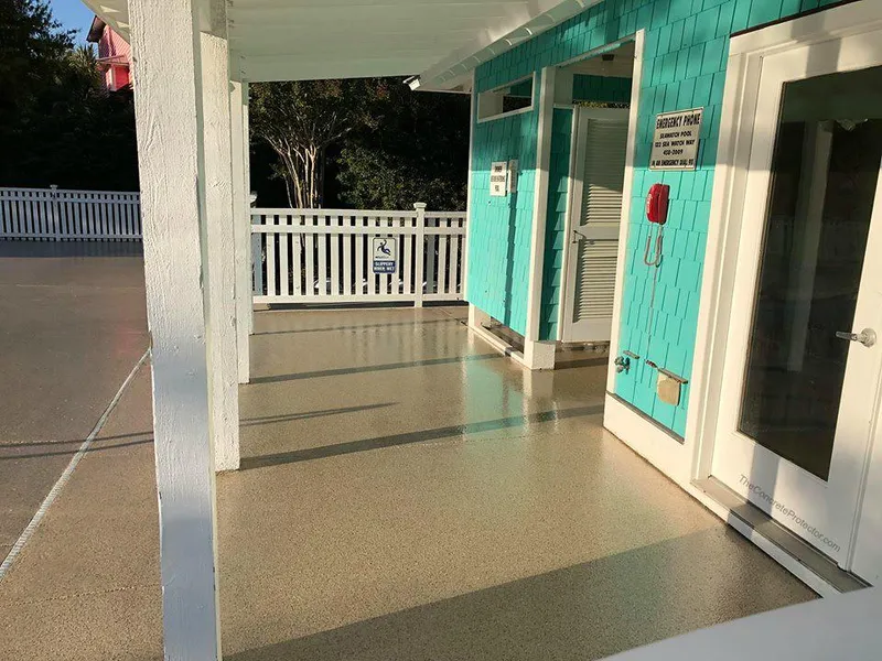Coated porch floor outside a pool house