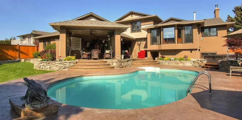 Backyard pool with a decorative concrete deck